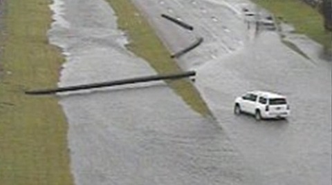 A flooded road in Houston traps a vehicle